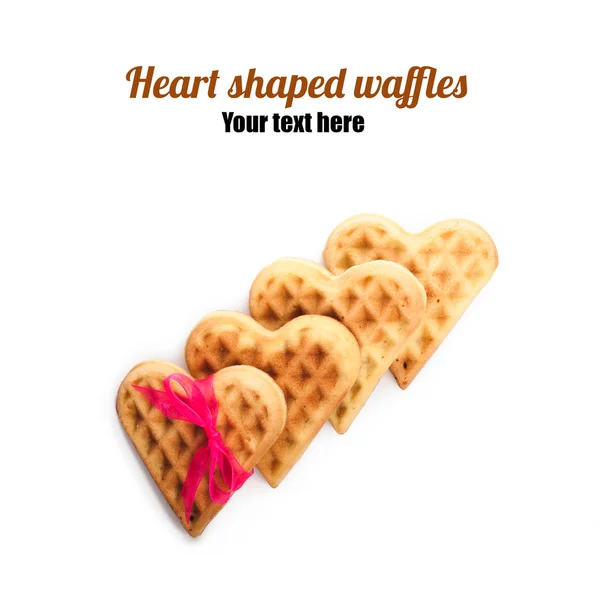 Heart shaped waffles with pink ribbon — Stock Photo, Image