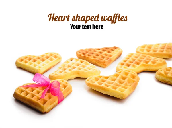 Heart shaped waffles with pink ribbon — Stock Photo, Image
