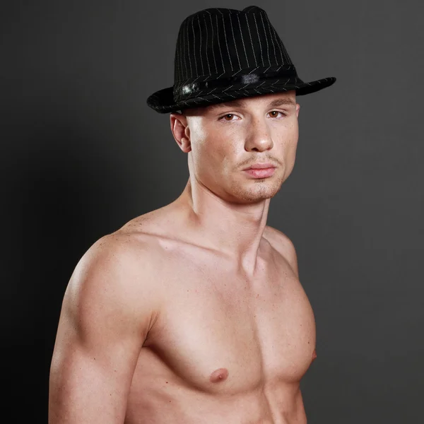 Bald man in black hat — Stock Photo, Image