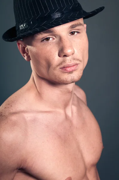 Bald man in black hat — Stock Photo, Image