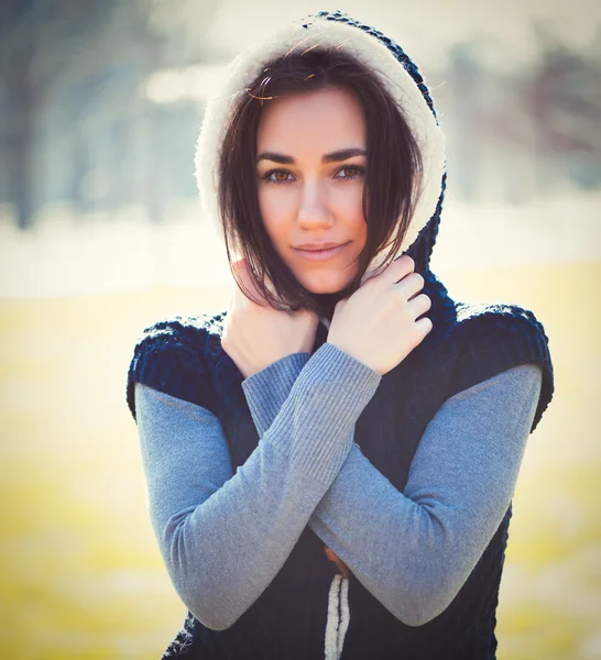 Young thoughtful woman in hood — Stock Photo, Image