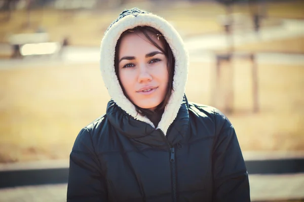 Young thoughtful woman in hood — Stock Photo, Image