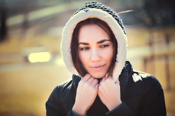 Young thoughtful woman in hood — Stock Photo, Image