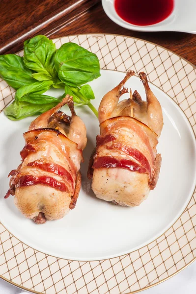 Two fried quails with bacon — Stock Photo, Image