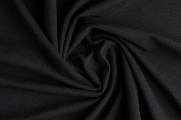 Spiral folds on black cloth — Stock Photo, Image