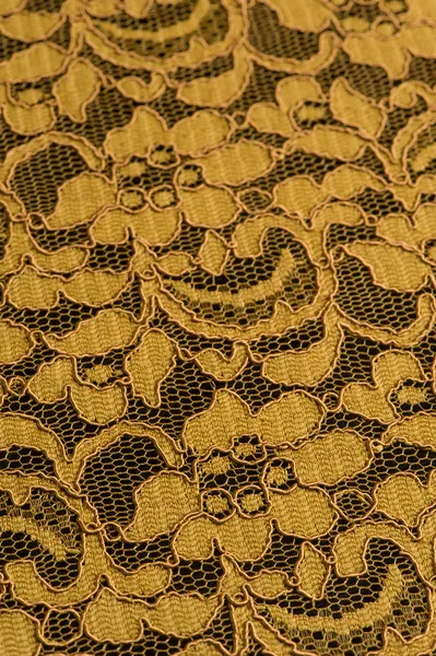 Yellow lace fabric with flower pattern — Stock Photo, Image