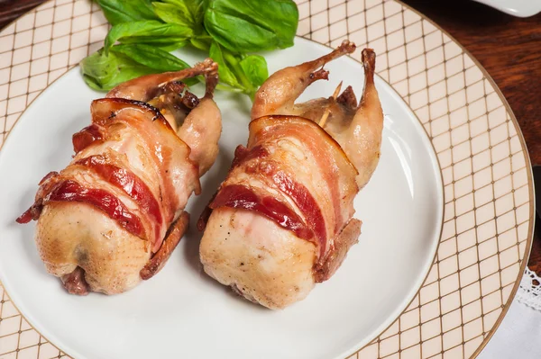 Two fried quails with bacon — Stock Photo, Image