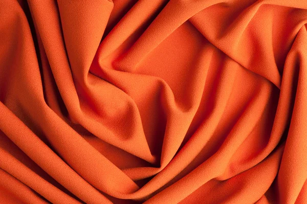 Складки спирали на красной ткани — стоковое фото