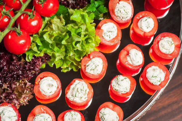 Tomatoes stuffed with cheese — Stock Photo, Image