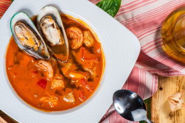 Spanish tomato soup with seafood clipart