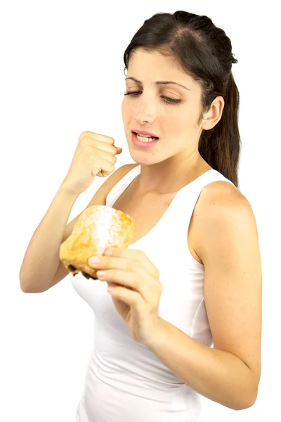 Όμορφο κορίτσι που προσπαθεί να είναι σε μια διατροφή καταπολέμηση γλυκό σνακ — Φωτογραφία Αρχείου