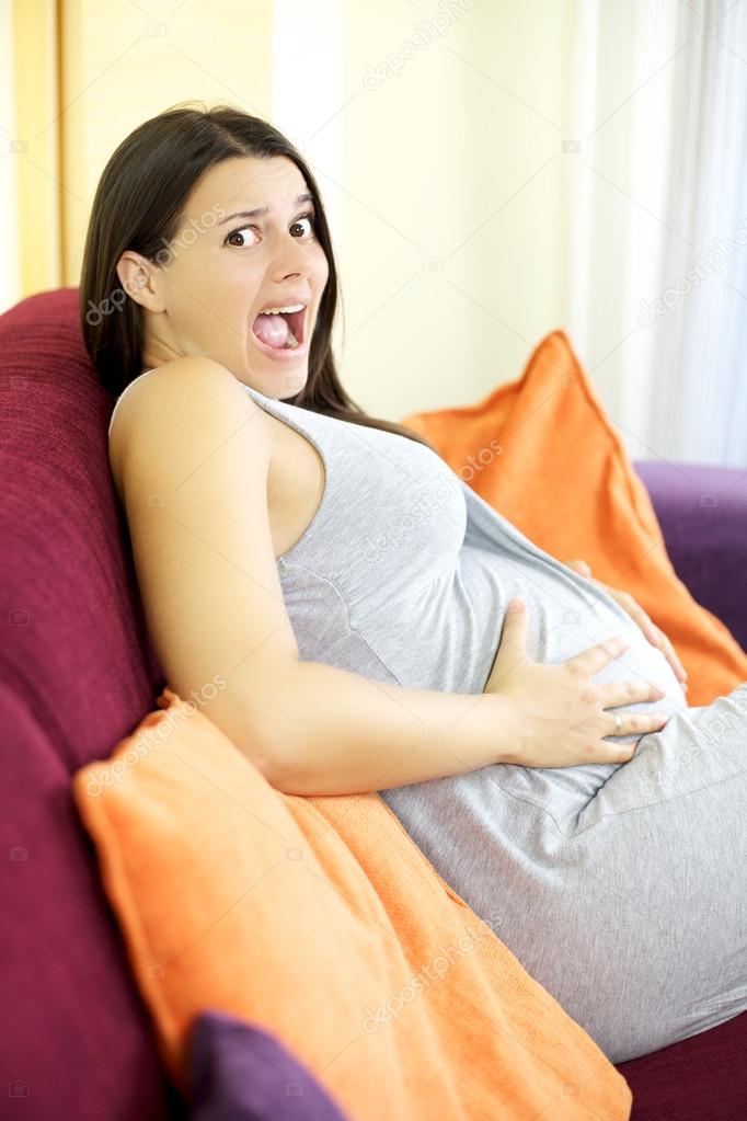 Beautiful pregnant woman scared about delivering