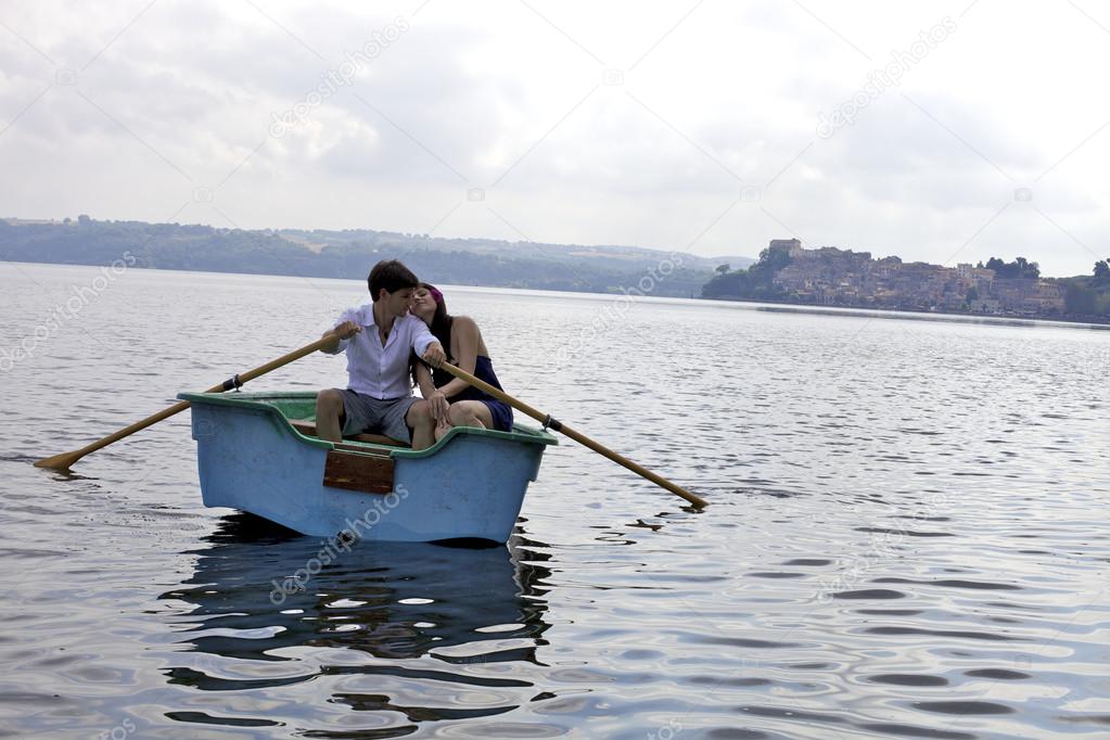 Happy couple in love on boat in vacation in Italy