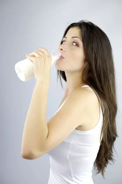 Happy woman drinking milk looking — Stock Photo, Image