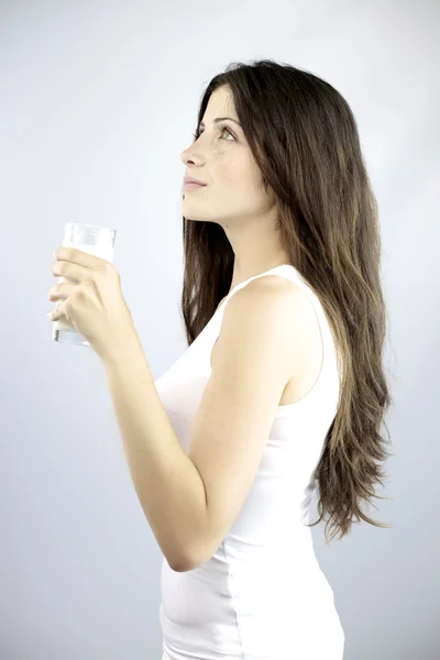 Pure image of beautiful model with glass of milk — Stock Photo, Image