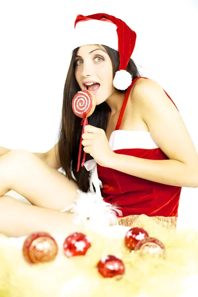 Sexy santa claus ready to eat Christmas lollipop — Stock Photo, Image