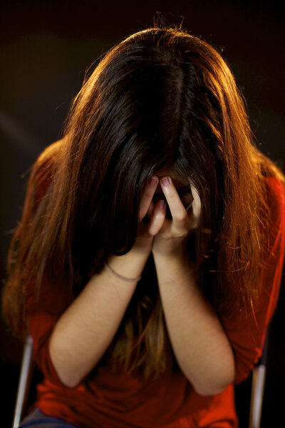 Terrified woman crying after abuse