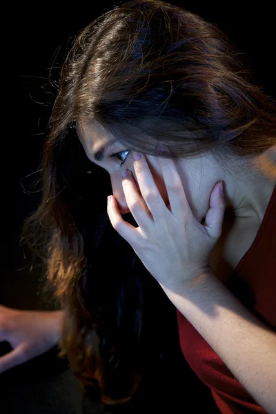 Woman holding her face after violence on the street — Stock Photo, Image