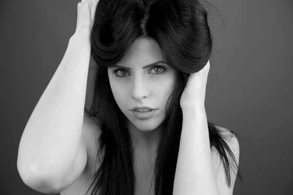 Sexy woman playing with long black hair — Stock Photo, Image