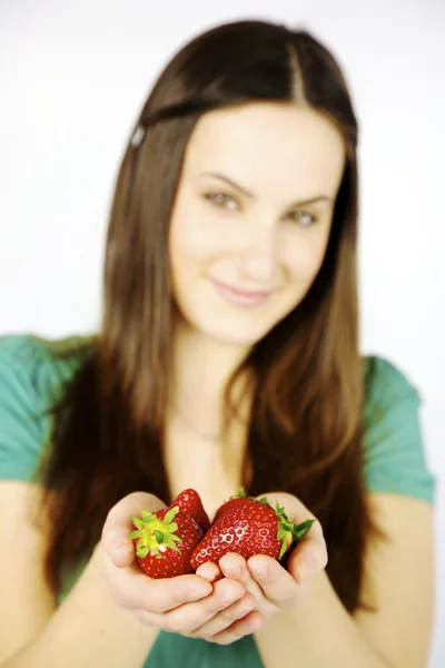 Closeup of fresh strawberries in hands of female model — Stock Photo, Image
