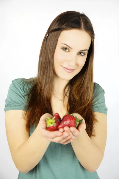 Happy woman showing fresh strawberry — Stock Photo, Image