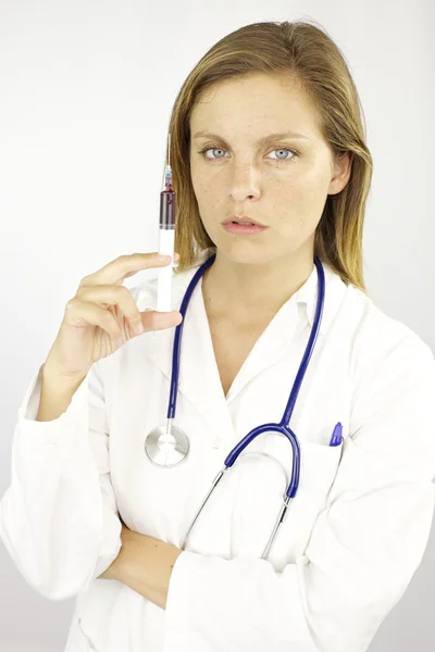 Doctor with siringe full of blood ready for test Royalty Free Stock Photos