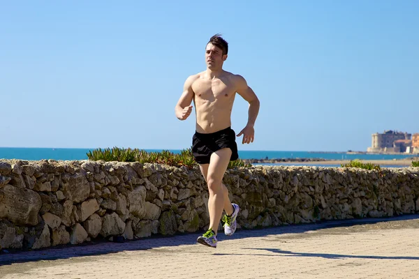 Cool muscular man running on street — Stock Photo, Image