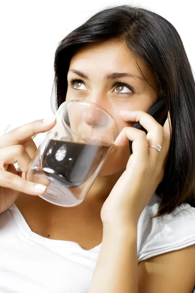 Beautiful girl talking on the phone while drinking coffee — Stock Photo, Image