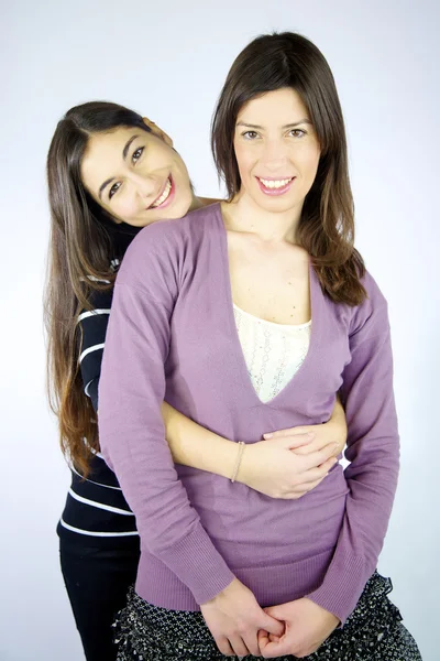 Two happy girlfriends hugged smiling — Stock Photo, Image