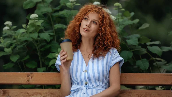 Dreamy Redhead Woman Dress Holding Paper Cup While Sitting Bench — Stock Photo, Image