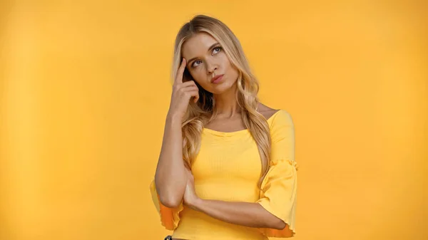 Thoughtful Blonde Woman Standing Isolated Yellow — Stock Photo, Image