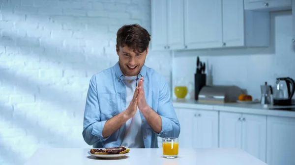 Pleased Man Rubbing Hands Toasts Confiture Orange Juice Kitchen — Stock Photo, Image