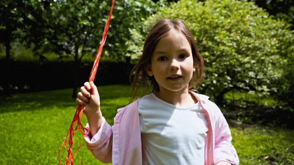 Girl Holding Balloons Looking Camera Green Park — Stockfoto