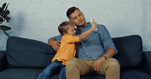 Serious Father Son Casual Clothing Taking Selfie Home — Stock Photo, Image