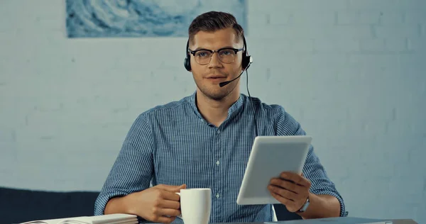 Operator Headset Glasses Holding Cup Coffee Using Digital Tablet — Stock Fotó