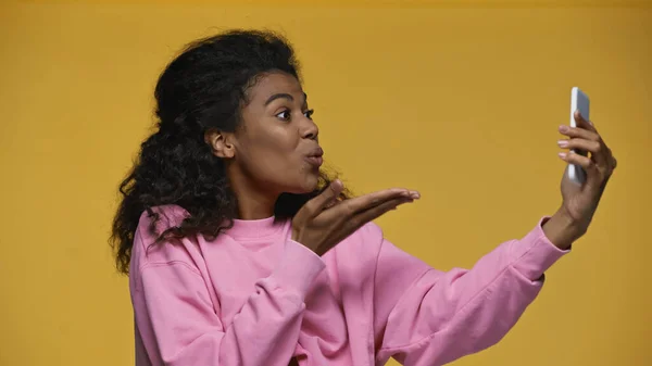 African American Woman Pink Sweatshirt Sending Air Kiss While Taking — Zdjęcie stockowe