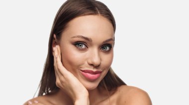 portrait of cheerful young woman with makeup smiling and looking at camera isolated on white 