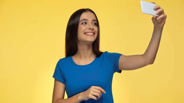 Young Brunette Woman Blue Shirt Smiling While Taking Selfie Isolated — Foto de Stock