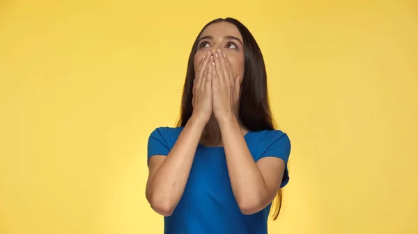 Emotional Young Woman Blue Shirt Covering Mouth Looking Isolated Yellow — Stockfoto
