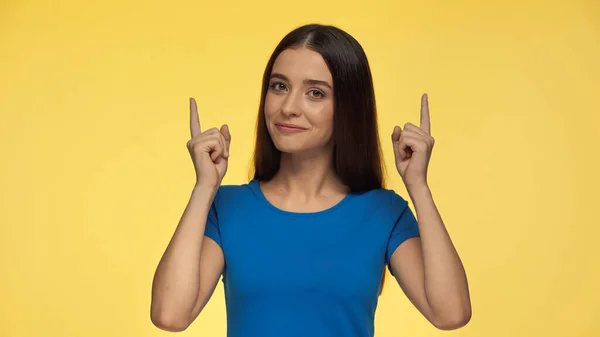 Young Cheerful Woman Blue Shirt Pointing Fingers Isolated Yellow — 스톡 사진