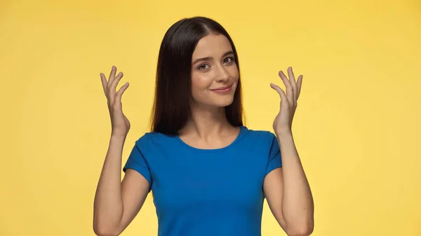 Young Smiling Woman Blue Shirt Gesturing Isolated Yellow — Stok Foto