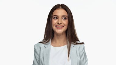 happy businesswoman in grey blazer looking away and smiling isolated on white