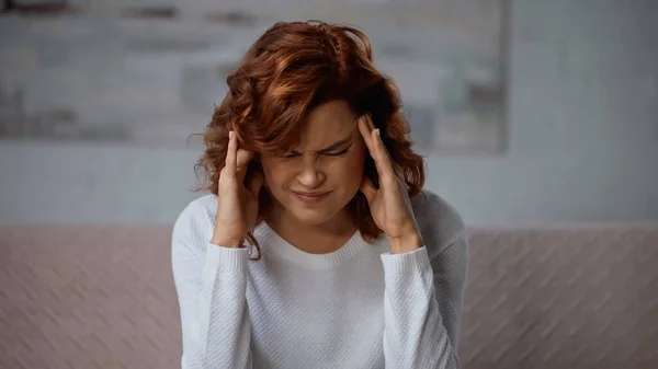 Redhead Woman Touching Head Hands While Suffering Headache Home — Stockfoto