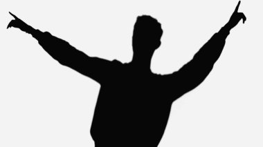 black silhouette of man pointing with fingers while dancing isolated on white