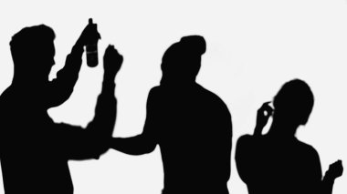 shadow of man with bottle of beer near silhouettes of dancing friends isolated on white