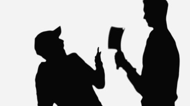 black shadow of killer with cleaver threatening frightened man isolated on white