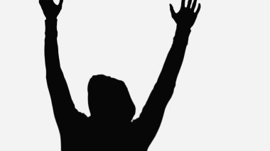 black silhouette of criminal man with hands up isolated on white