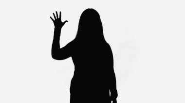 black silhouette of woman waving hand isolated on white