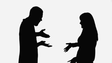 black silhouettes of couple quarreling isolated on white