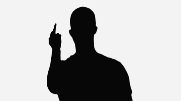 black silhouette of rude man showing middle finger isolated on white
